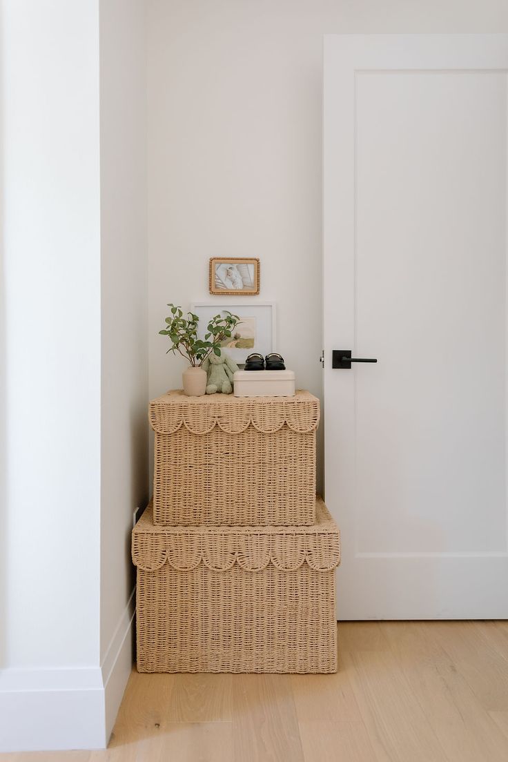 a white door and some wicker boxes