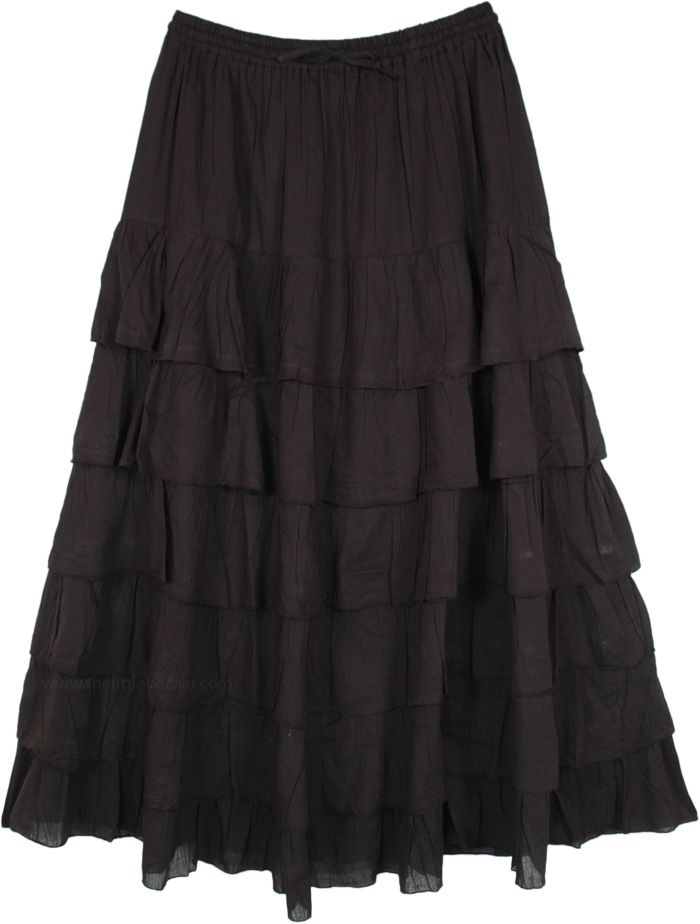 A black cotton maxi skirt with a difference - the flouncy ruffles makes for a bold addition to your bohemian wardrobe.  The skirt has an elastic waist with a drawstring for sizing flexibility. #tlb #Crinkle #TieredSkirt #MaxiSkirt #FairycoreSkirt #TieredSkirt #PixieSkirt Black Flowy Tiered Skirt, Black Tiered Gathered Skirt, Black Tiered Maxi Skirt For Summer, Black Cotton Flowy Maxi Skirt, Black Bohemian Maxi Skirt With Gathered Detail, Black Bohemian Gathered Maxi Skirt, Flowy Black Bohemian Maxi Skirt, Bohemian Black Flowy Maxi Skirt, Black Tiered Ruffled Maxi Skirt