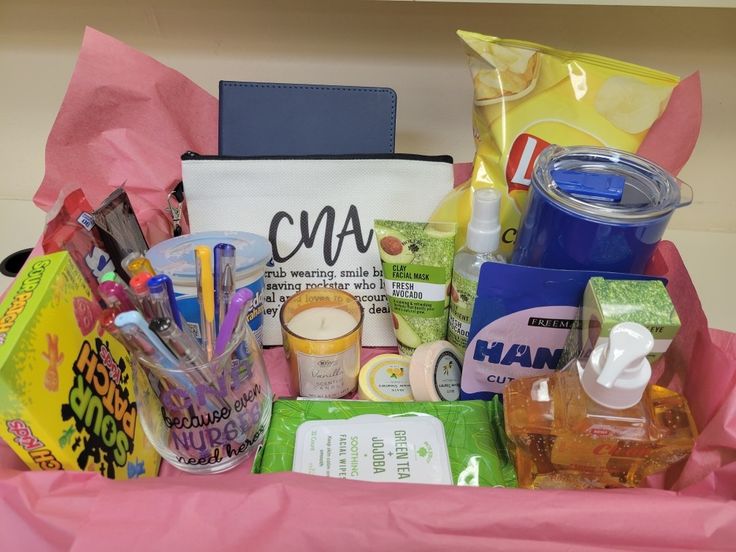 a pink bag filled with lots of different types of personal care products and hygiene items