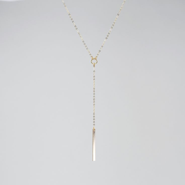 14k gold y necklace, 14k gold delicate y necklace This necklace is beautiful and delicate. The necklace will arrive in a gift box, ready for delivery. The bar is solid 14K gold, it is about 25mm x 2mmx1mm 14K gold necklace All components are 14k gold Please read our policies before you place your order. https://www.etsy.com/shop/SashJewelry/policy?ref=shopinfo_policies_leftnav To see other bracelets click here https://www.etsy.com/shop/SashJewelry?section_id=12354075&ref=shopsection_leftnav_ Dainty Long Drop Lariat Necklace With Delicate Chain, Delicate Long Drop Lariat Necklace With Delicate Chain, Delicate Long Drop Lariat Necklace, Minimalist Drop Necklace With Adjustable Dangle, Minimalist Y-shape Drop Necklace With Adjustable Chain, Minimalist Dangle Drop Necklace With Adjustable Length, Minimalist Y-shape Clavicle Chain Necklace, Minimalist Y-shape Drop Necklace With Delicate Chain, Minimalist Drop Necklace With Adjustable Length