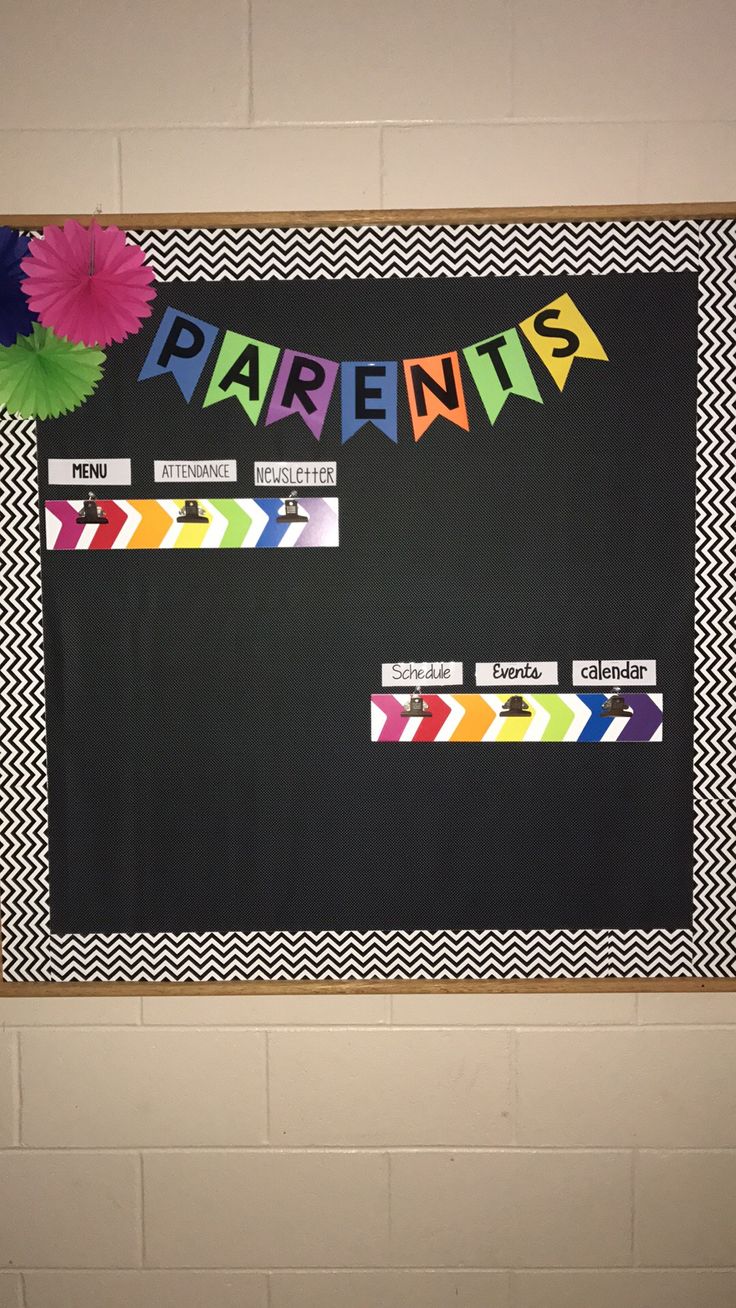 a bulletin board with the word parent's written on it and colorful paper flowers