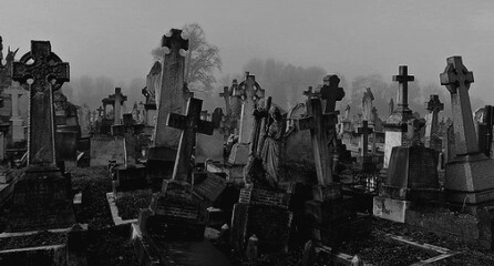 an old cemetery with many headstones and crosses