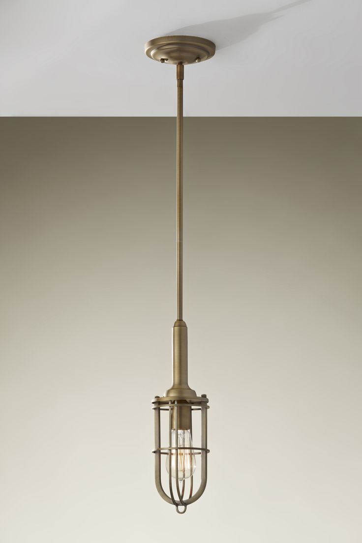 an old fashioned light fixture hanging from the ceiling