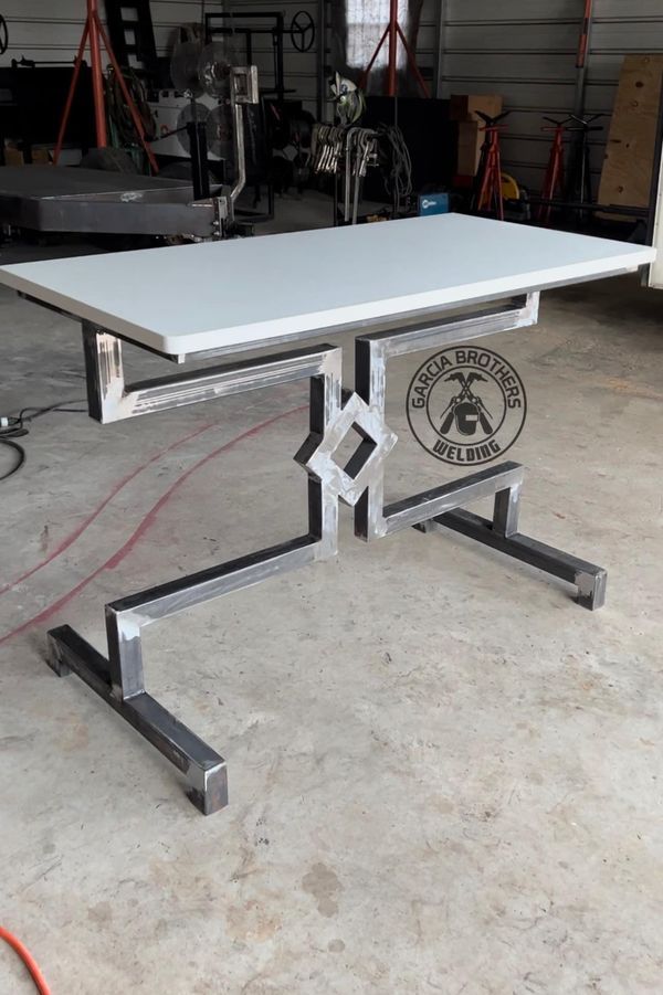 a white table sitting inside of a garage