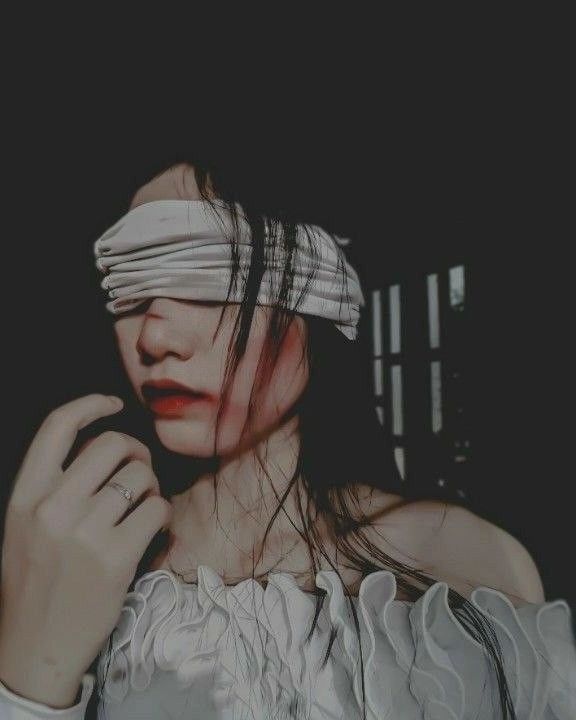 a woman with blind folded around her head