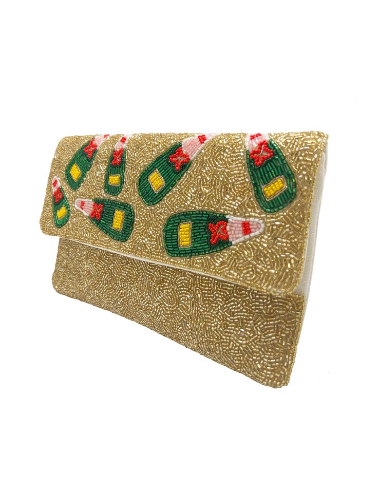 This beaded clutch also has a chain strap to wear as a crossbody. The beautiful beaded detail adds elegance and fun to any outfit. 10"x6" Festive Beaded Clutch Evening Bag, Beaded Rectangular Clutch For Festive Occasions, Rectangular Sequined Clutch As Gift, Beaded Rectangular Party Clutch, Embellished Clutch For Celebration, Chic Embellished Evening Bag For Festive Occasions, Rectangular Beaded Clutch For Festive Occasions, Embellished Rectangular Clutch For Celebration, Festive Beaded Rectangular Clutch