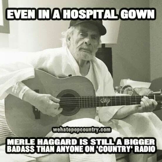 an old man sitting on a bed with a guitar in his lap and the caption reads even in a hospital gown