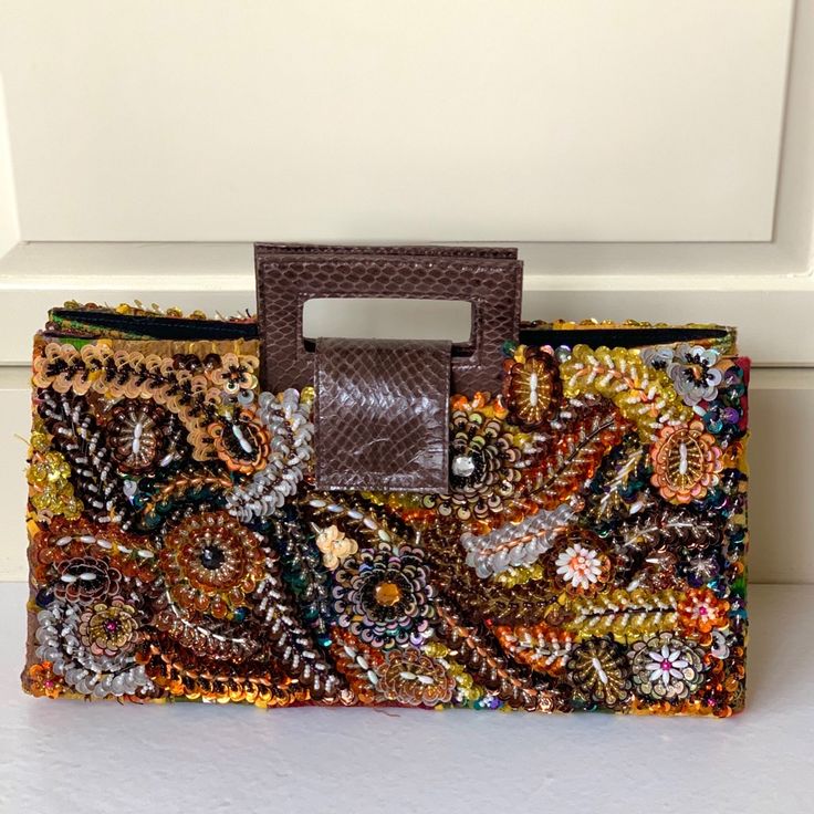 A Laura Lee’s Signature Handbag. Unique Bag Has Approximately 20,000 Beads, Measures 15x8x4, And Has An Interior Zipper To Secure Your Valuables. Brand New - Never Used! Luxury Multicolor Box Bag With Detachable Handle, Orange Rectangular Box Bag With Detachable Strap, Rectangular Orange Box Bag With Detachable Strap, Designer Rectangular Clutch With Handles, Multicolor Clutch Bag With Handles, Multicolor Clutch With Handles, Luxury Multicolor Rectangular Clutch, Orange Rectangular Bag With Detachable Handle, Luxury Multicolor Pouch Clutch