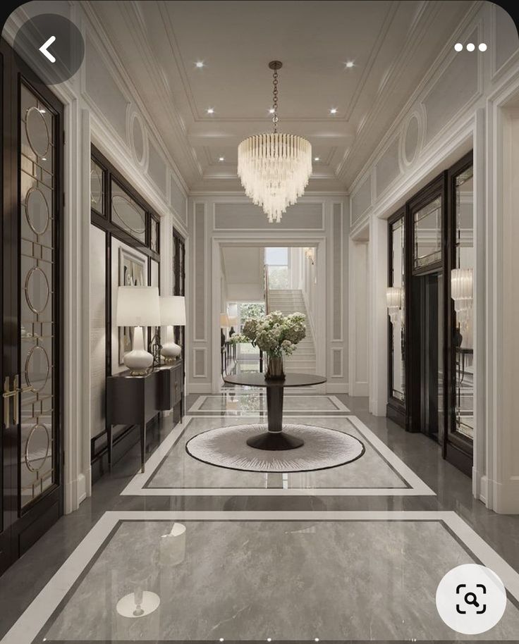 an elegant hallway with chandelier and marble flooring