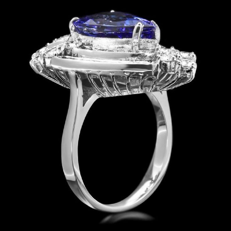 7.20 Carats Natural Very Nice Looking Tanzanite and Diamond 14K Solid White Gold Ring Suggested Replacement Value: Approx. $7,900.00 Total Natural Pear Shaped Tanzanite Weight is: Approx. 5.00 Carats Tanzanite Measures: Approx. 14.00 x 9.00mm Natural Round Diamonds Weight: Approx. 2.20 Carats (color G-H / Clarity SI1-SI2) Ring total weight: Approx. 8.2 grams Disclaimer: all weights, measurements and colors are approximate and may vary slightly from the listed dimensions or as seen in the image. Gia Certified Trillion Cut Diamond Ring For Formal Events, Gia Certified Trillion Cut Diamond Ring For Formal Occasions, Formal Trillion Cut Diamond Ring With Gemstone, Elegant Pear-shaped Gemstones For Formal Occasions, Trillion Cut Diamond Ring With Gemstone For Formal Occasions, Formal Platinum Rings With Trillion Cut, Formal White Gold Trillion Cut Jewelry, Gia Certified Luxury Pear-shaped Jewelry, Gia Certified Trillion Cut Jewelry For Formal Occasions