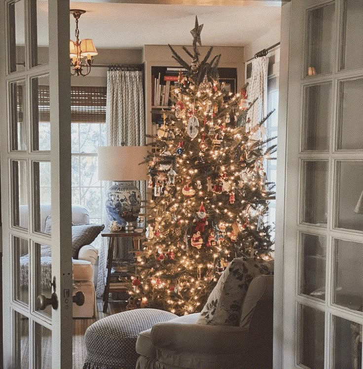 a living room with a christmas tree in the corner