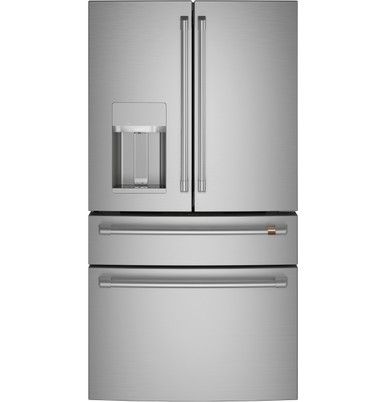 a silver refrigerator freezer sitting next to a white wall with the door open and water dispenser on it