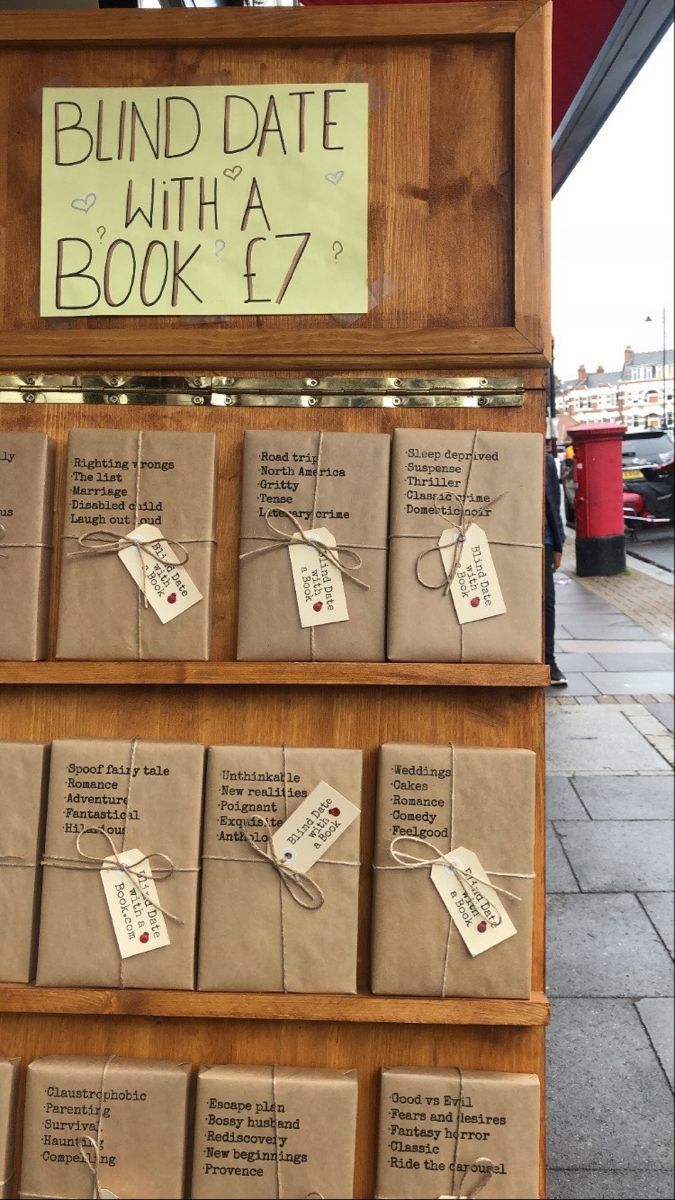 boxes are stacked on top of each other in front of a sign that says blind date with a book 7