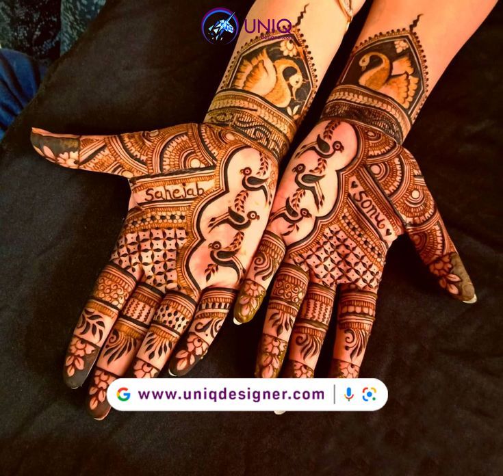 two hands with henna designs on them