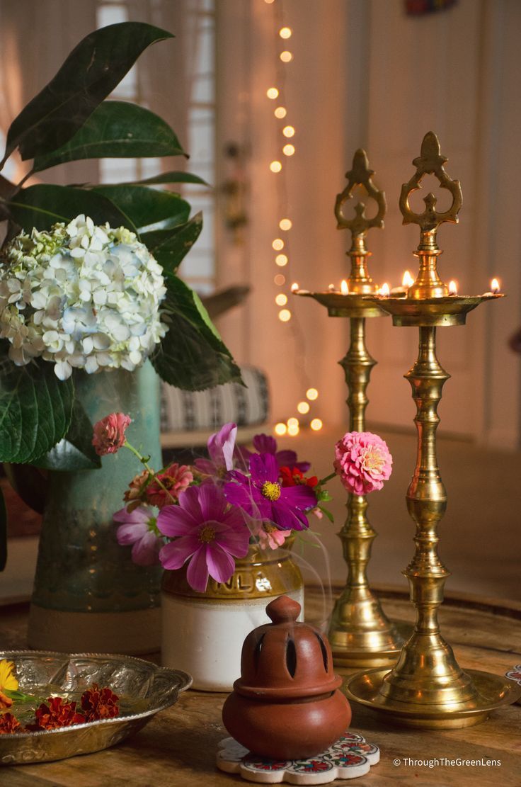 a table topped with lots of different types of flowers and vases on top of it