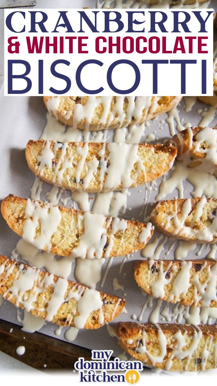 cranberry and white chocolate biscotti on a baking sheet with icing