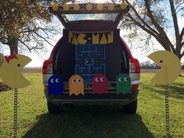 the back end of a car decorated with pacman decorations