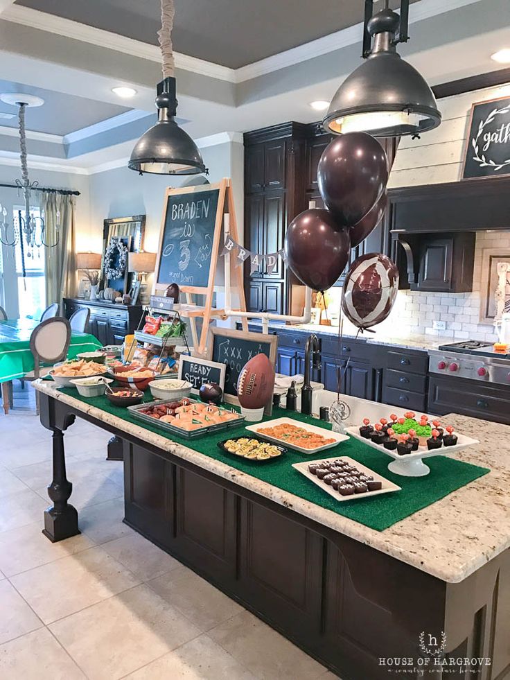 a kitchen filled with lots of food and balloons