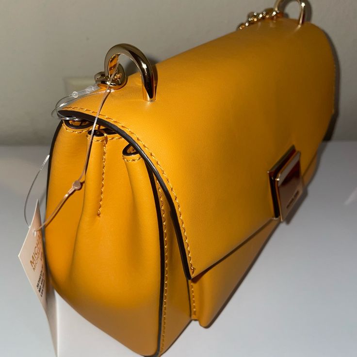 Beautiful Leather Bag With A Bright Orange Color . Brand New With Tags! Trendy Tan Shoulder Bag For Formal Occasions, Trendy Tan Formal Shoulder Bag, Evening Yellow Flap Bag With Detachable Strap, Modern Gold Flap Bag With Adjustable Strap, Yellow Evening Flap Bag With Detachable Strap, Elegant Yellow Bag With Branded Hardware, Classic Yellow Shoulder Bag For Formal Occasions, Formal Yellow Bags With Gold-tone Hardware, Elegant Yellow Bags With Branded Hardware