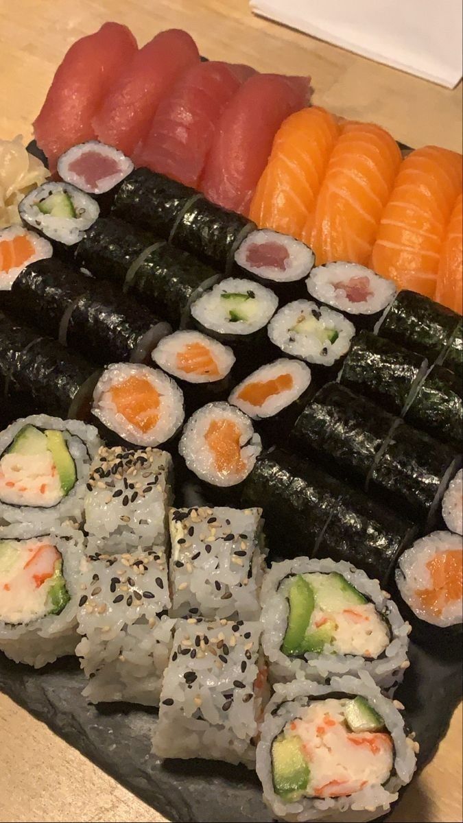 sushi platter with several different types of sushi