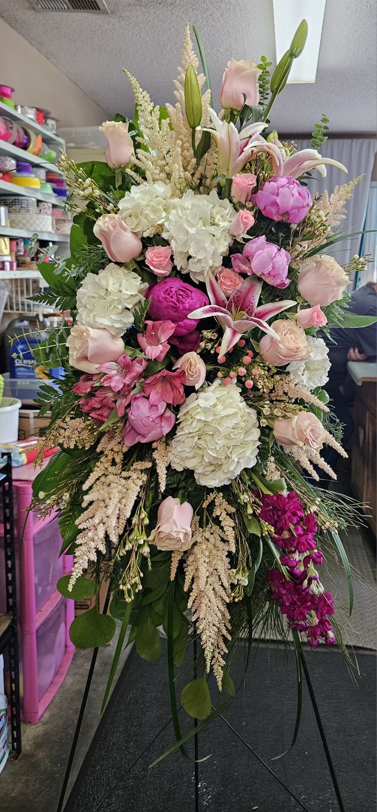 a large bouquet of flowers on display in a flower shop or florist shop