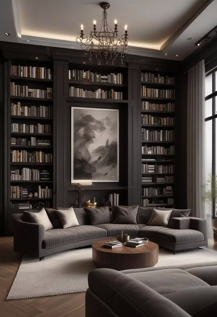 a living room with lots of bookshelves and couches in front of a window