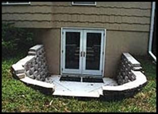 an outside view of a house with stone walls and doors