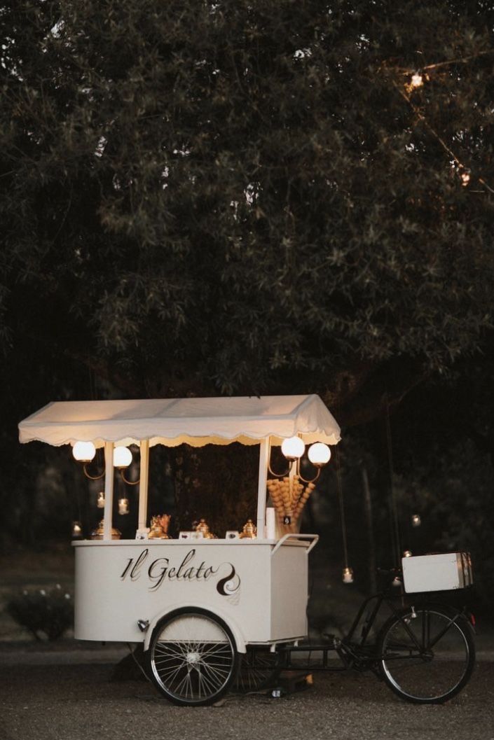 an ice cream cart with lights on it