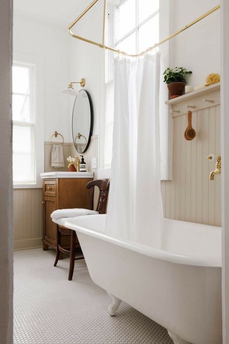 a white bath tub sitting next to a window