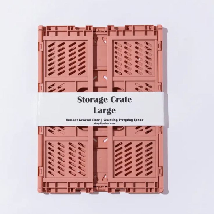 three pink crates with white labels on them