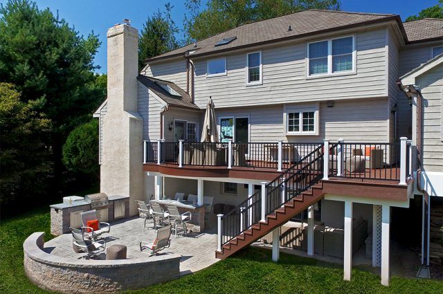 an aerial view of a house with patio and fire pit