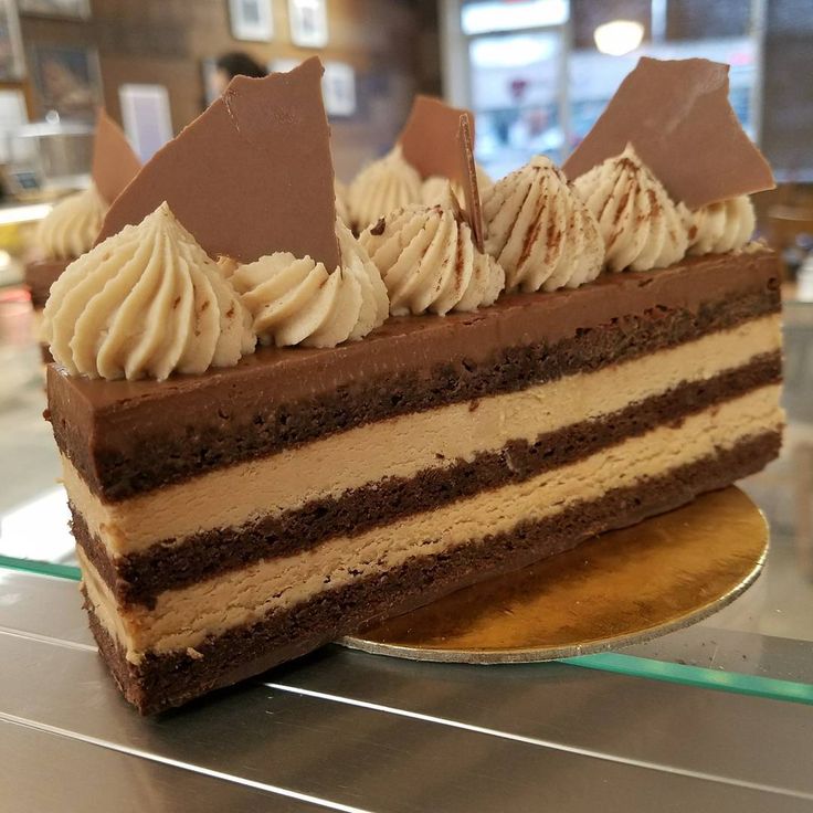 a piece of cake with chocolate and cream frosting