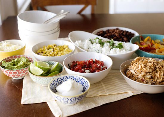 bowls filled with different types of food on top of a table