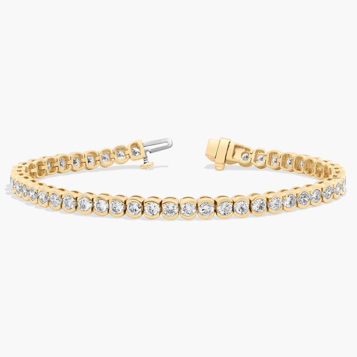 Simple and elegant, this bezel lab-grown tennis bracelet features round lab-growns framed in 14k yellow gold. Pearl Bracelet Gold, Platinum Rose Gold, Engagement Rings Marquise, Gold Rings Fashion, Diamond Tennis Bracelet, Gold Pearl Necklace, Ladies Diamond Rings, Yellow Gold Chain, Tennis Bracelet Diamond