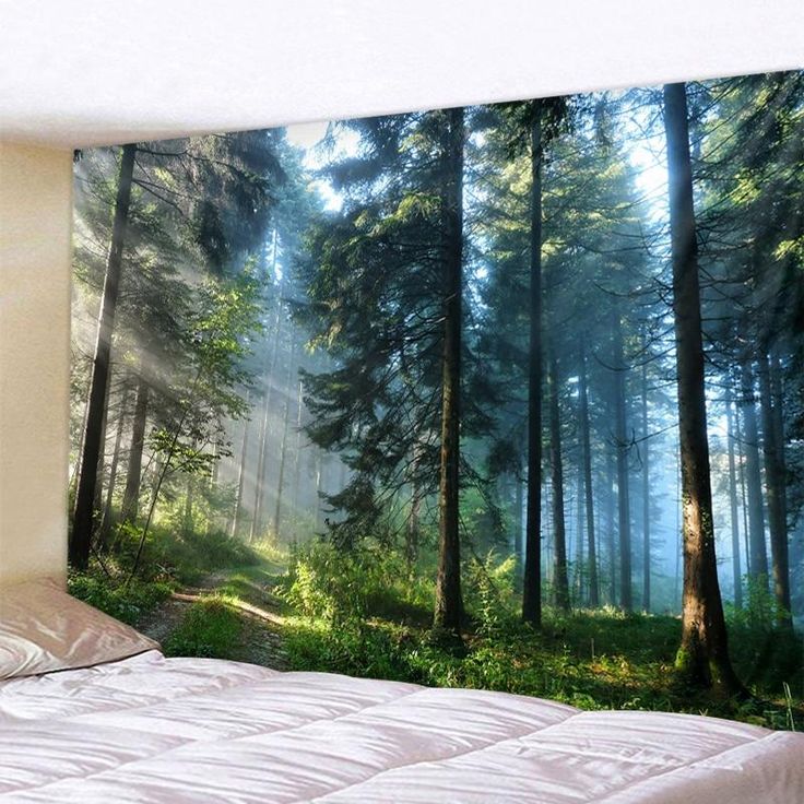 a bed room with a neatly made bed and a large wall mural