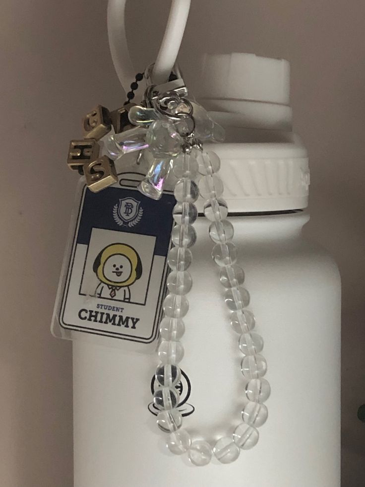 a bottle with a chain attached to it