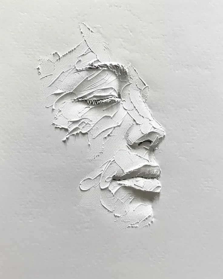 a drawing of a person's face with white paint on it