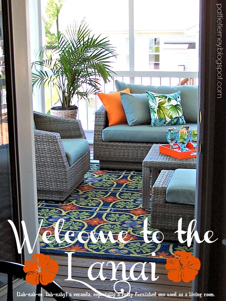 the front porch is decorated with wicker furniture and colorful pillows, along with an area rug that says welcome to the lana