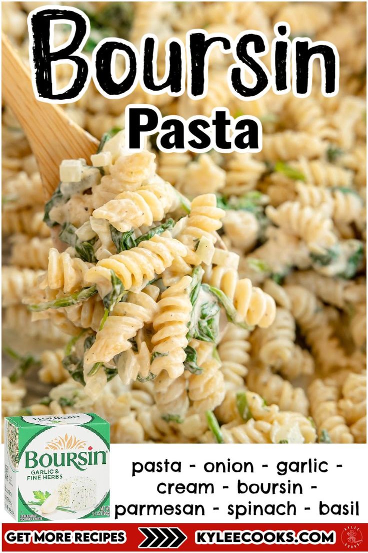 pasta with spinach and parmesan cheese is being served on a wooden spoon