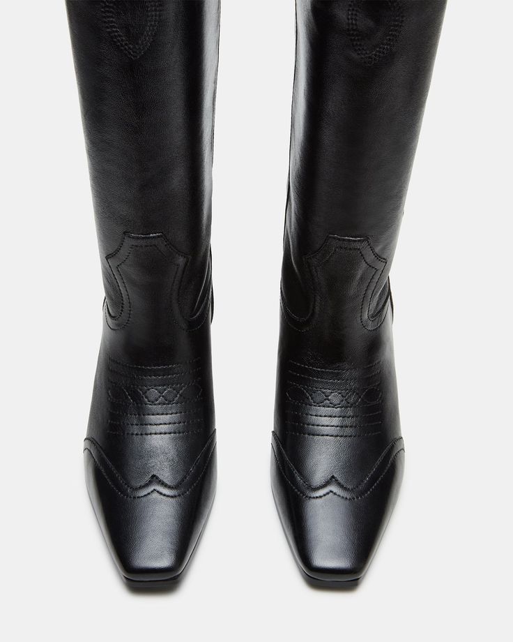 The DOLLIE Western boot offers a sleek and stylish design with a square toe. Experience comfort and durability with every step. Elevate your wardrobe with this timeless and versatile statement piece. 1.75 inch heel height Size 6 measurements: 15 inch shaft circumference, 13 inch shaft height Size 8 measurements: 16 inch shaft circumference, 14 inch shaft height Size 10 measurements: 17 inch shaft circumference, 14.75 inch shaft height Leather upper material Textile and synthetic lining Synthetic Classic Square Toe Knee-high Boots For Fall, Classic Knee-high Heeled Boots With Medium Width, Classic Wide Calf Mid-calf Boots With Block Heel, Classic Mid-calf Boots With Wide Calf And Block Heel, Classic Medium Width Knee-high Heeled Boots, Wide Calf Mid-calf Boots For Formal Occasions, Classic Calf Leather Knee-high Boots With Square Toe, Classic Knee-high Boots With Block Heel, Classic Wide Calf Knee-high Boots With Square Toe