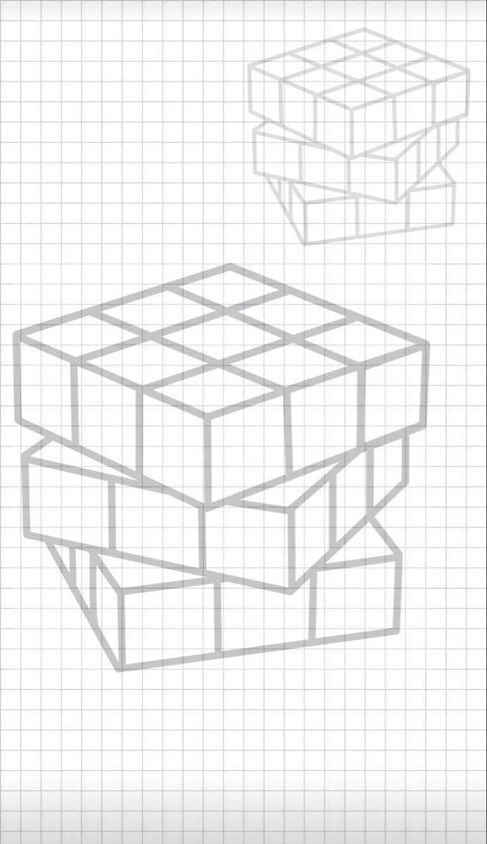 three dimensional cubes on lined paper with one drawn in the middle and another drawn to the