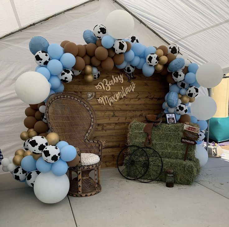 a decorated stage with balloons and decorations for a baby shower