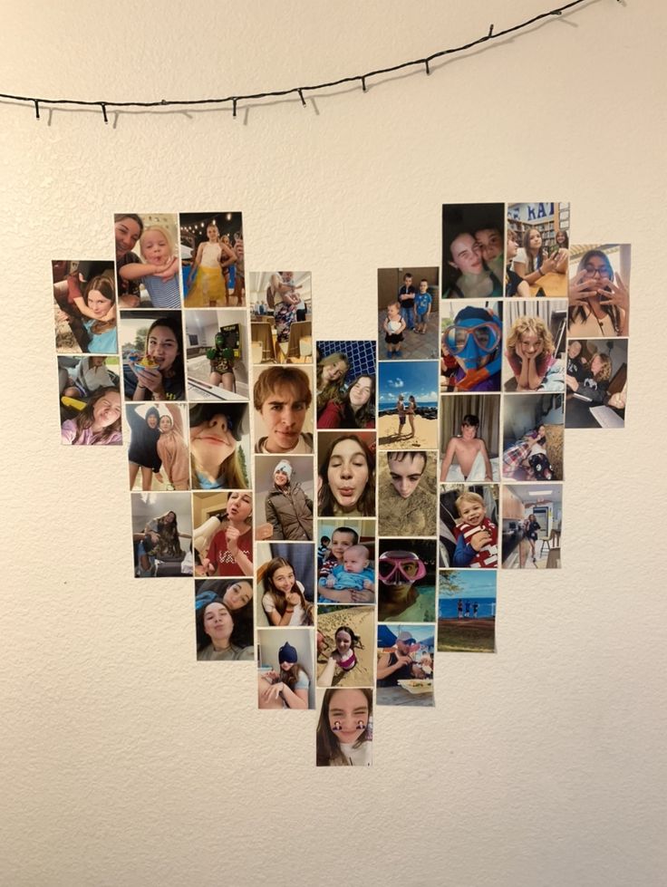 a heart shaped photo collage hanging on a string