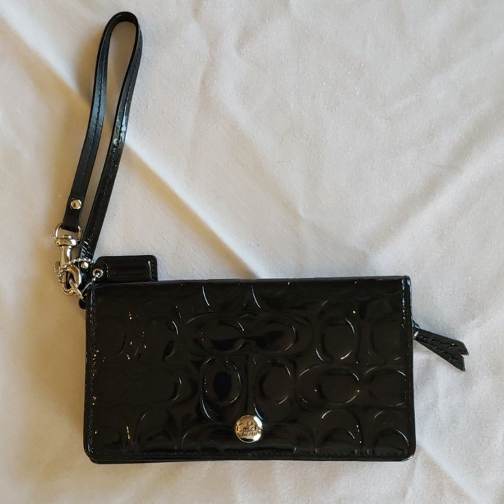 Coach New With Out Tags Wristlet Wallet. New Never Used. Shiny Black. Black Clutch Wristlet For Formal Occasions, Black Wallets With Wrist Strap For Evening, Coach Evening Clutch Wallet, Black Formal Wristlet With Removable Pouch, Coach Elegant Wallet With Cell Phone Pocket, Black Evening Wallet With Wrist Strap, Black Formal Clutch Wristlet, Coach Clutch Wallet, Coach Clutch Wristlet For Evening