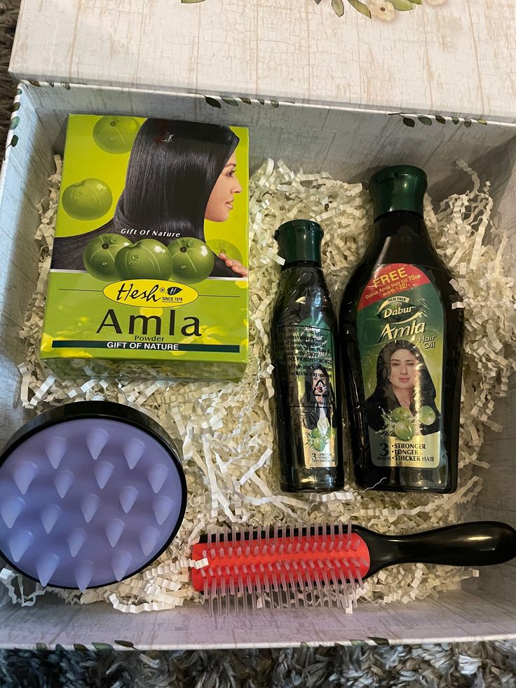 This is an essential Hair Care Kit for long and healthy growing hair. Comes with 2 bottles of Amla hair oil and Amla Powder. Also includes a hair massager and Denman brush.  Indian hair care teaches to put Amla oil(1-2 times a week) and massage into the scalp for 10-15 mins and leave overnight for healthy growth.  The Amla powder is to be used once a week as a hair mask. One needs to keep it on for 30 mins and then wash it with a shampoo conditioner. A scalp massager is an essential tool while p Indian Haircare Products, Indian Shampoo, Indian Hair Oiling, Indian Hair Mask, Hair Indian, Indian Hair Products, Indian Hair Care Products, Indian Hair, Hair Oiling