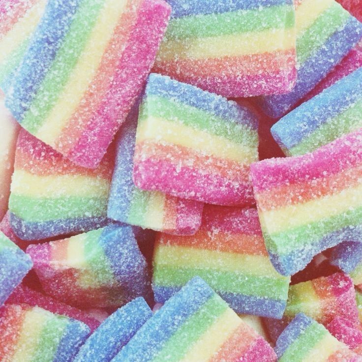 there is a pile of rainbow colored candy