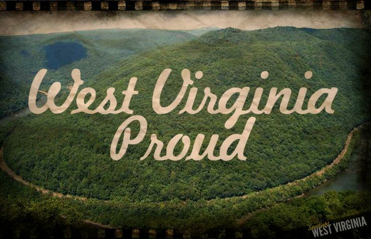 the words west virginia proud on top of a mountain