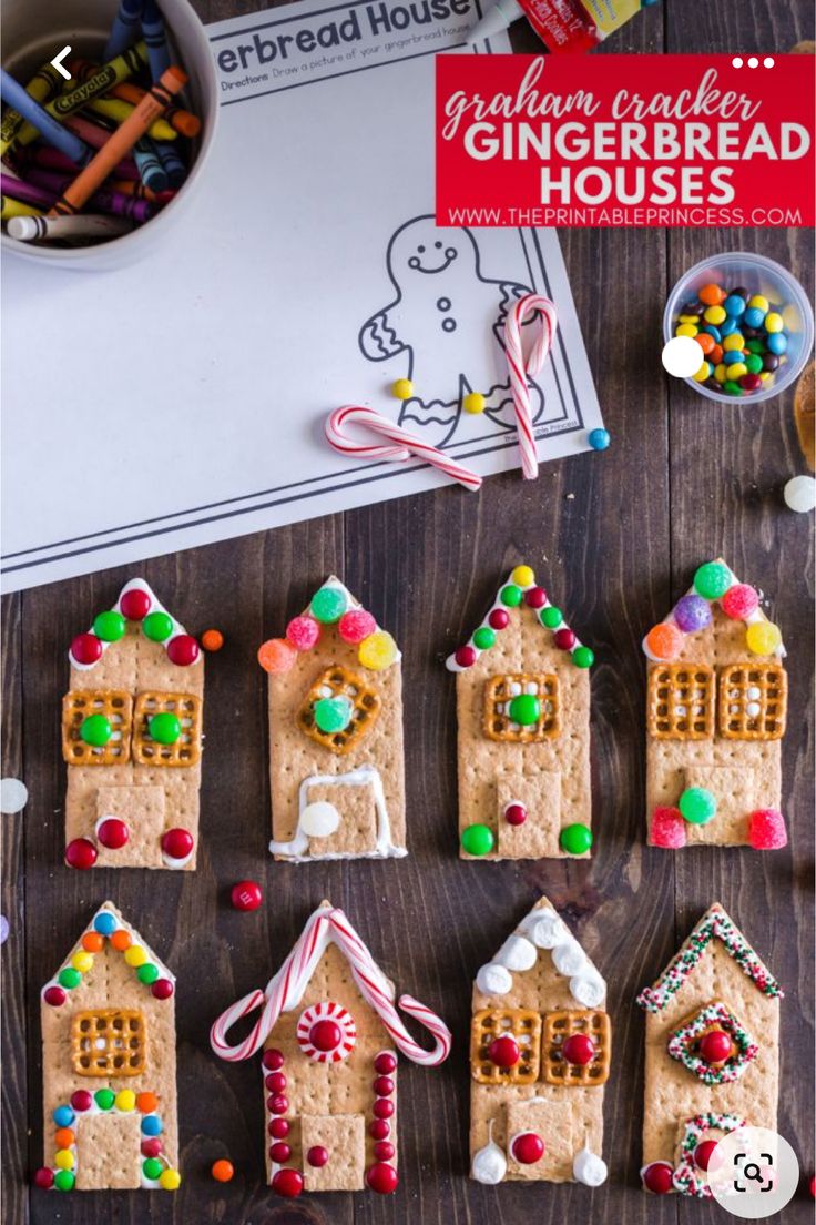 gingerbread houses made out of graham crackers and candy