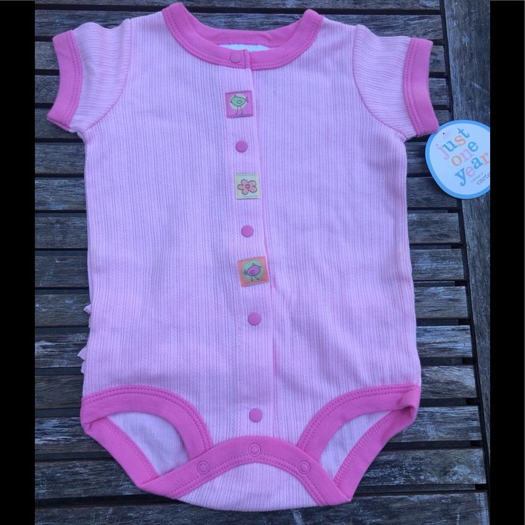 New And Oh So Cute! With A Cute Little Ruffle On The Tush, This Is A Perfect Little Outfit To Go Out In! Playful Short Sleeve Onesie For Spring, Fun Pink Onesie For Spring, Fun Pink Spring Onesie, Fun Cotton Bodysuit For Spring, Cute Bodysuit For Playtime In Spring, Cute Bodysuit For Spring Playtime, Cute Onesie For Spring Playtime, Casual Pink Onesie For Playtime, Cute Spring Onesie For Playtime