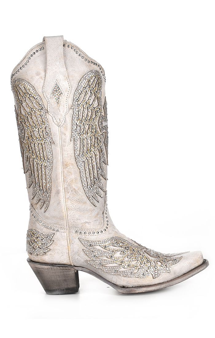 a pair of white cowboy boots with angel wings